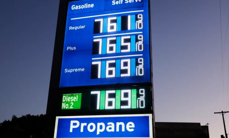 Gas prices displayed on a sign for Regular, Plus, Supreme, and Diesel No. 2 all showing $7.69 and 9/10, with a separate sign for Propane below.