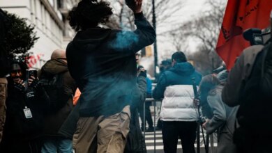 A suspect throws a handmade explosive at supporters of U.S. President Donald Trump during a rally to stop public Muslim prayer, in New York City, U.S., March 7, 2026.