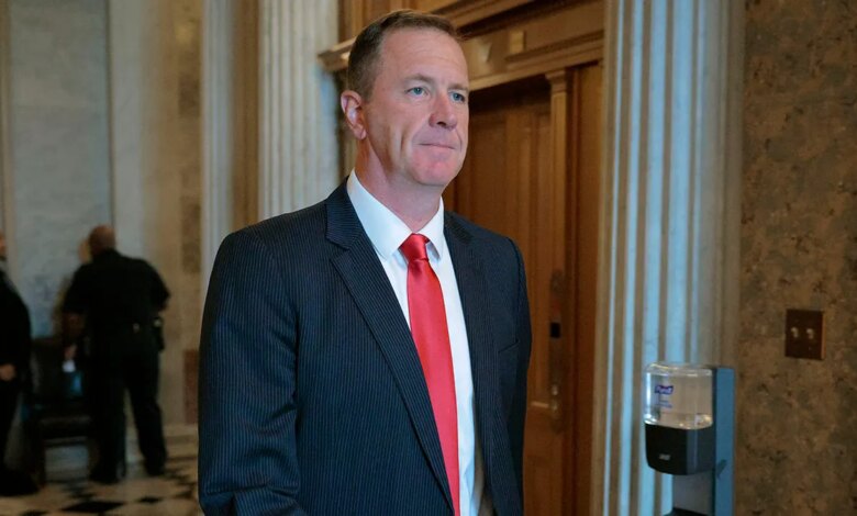 Sen. Eric Schmitt, R-Mo., walking from the Senate floor.