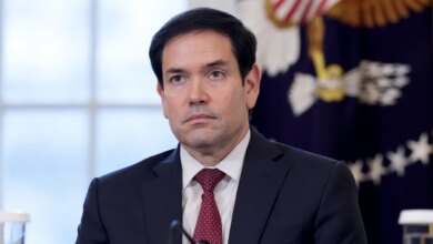 U.S. Secretary of State Marco Rubio stands attentively in the East Room during a meeting with energy industry leaders at the White House.