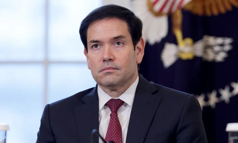 U.S. Secretary of State Marco Rubio stands attentively in the East Room during a meeting with energy industry leaders at the White House.