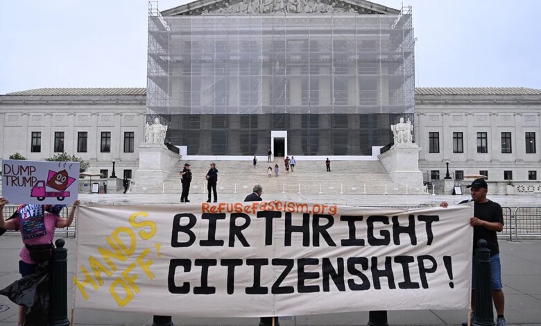 Protesters hold up birthright citizenship banner outside Supreme Court