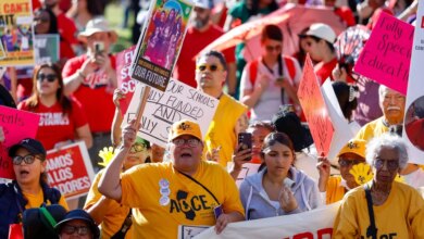 People rally for LAUSD workers, holding signs for fully funded schools and special education.
