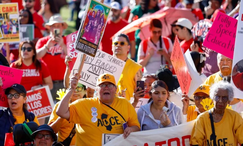 People rally for LAUSD workers, holding signs for fully funded schools and special education.
