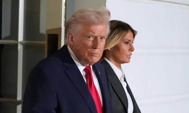 Donald Trump and Melania Trump walking out of the White House in Washington.