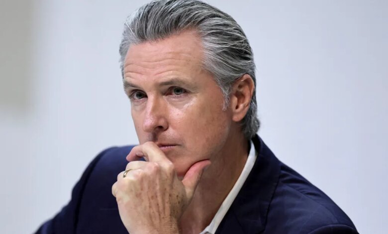 Gavin Newsom, governor of California, with his hand on his chin.