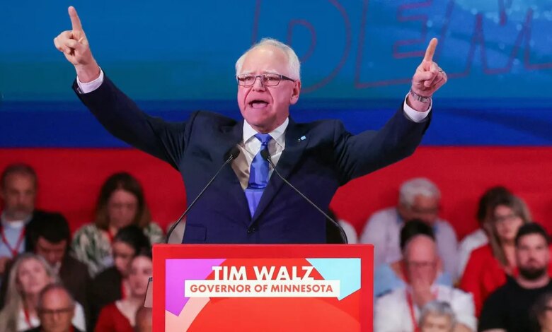 Governor Tim Walz gesturing during an event in Barcelona, Spain