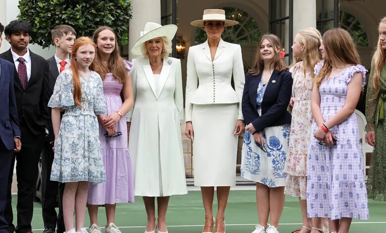 First lady Melania Trump and Queen Camilla standing with students at White House Tennis Pavilion