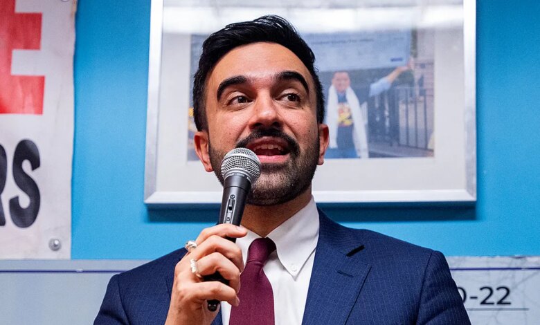 New York City Mayor Zohran Mamdani speaking at a podium during a Ramadan Iftar event