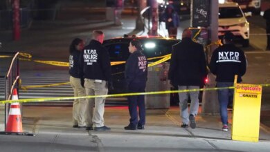 NYPD officers at the scene where an armed man was shot on W125th Street near Amsterdam Avenue.