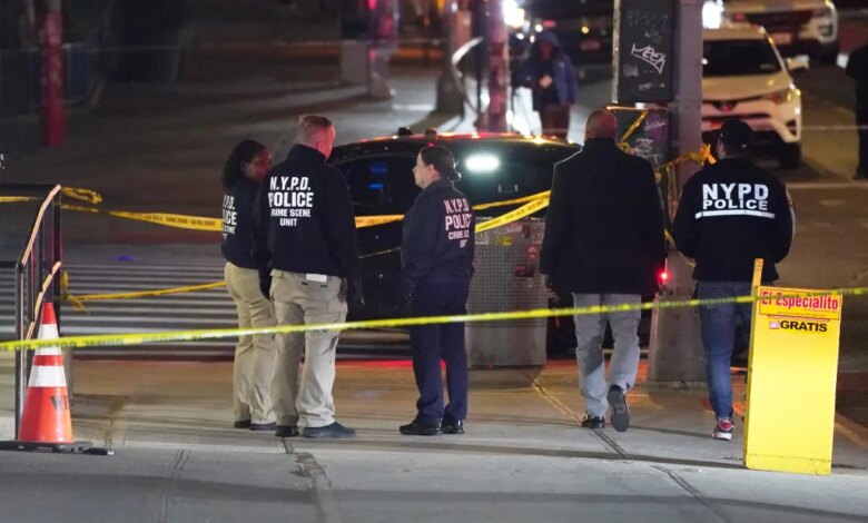 NYPD officers at the scene where an armed man was shot on W125th Street near Amsterdam Avenue.