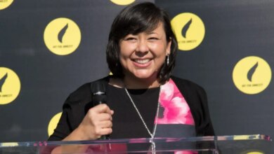 Margaret Huang standing and smiling at an event