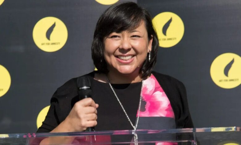 Margaret Huang standing and smiling at an event