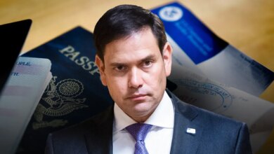 Sen. Marco Rubio holding U.S. passports in front of a blue background