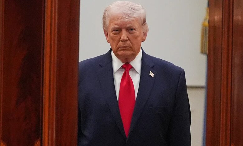 President Donald Trump standing in the Cross Hall of the White House speaking