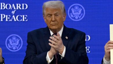 President Donald Trump clapping at the signing ceremony in Davos Switzerland