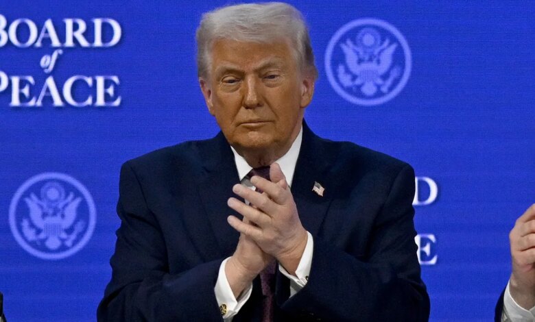 President Donald Trump clapping at the signing ceremony in Davos Switzerland