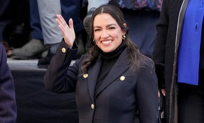 Rep. Alexandria Ocasio-Cortez waving to crowd at City Hall in New York City