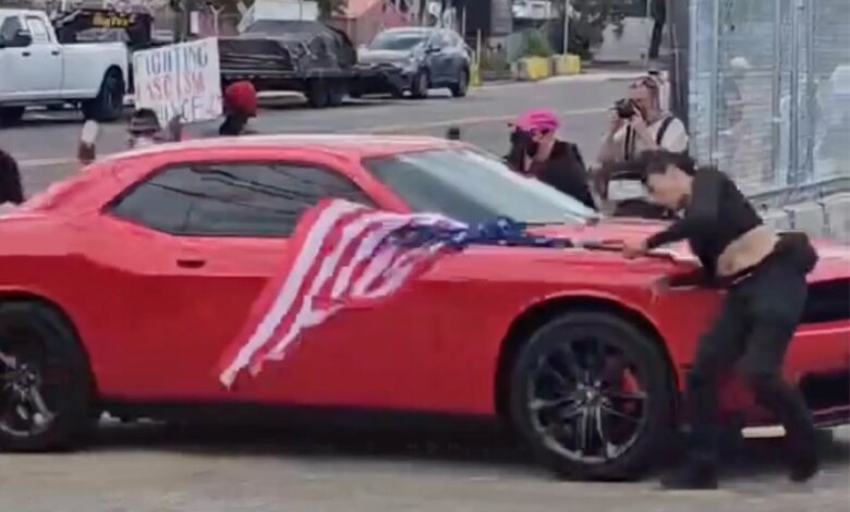 Anti-ICE protester hit by car while waving upside-down US flag outside Delaney Hall
