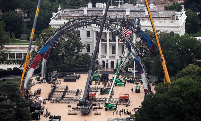 Construction workers preparing the South Lawn of the White House for a UFC match