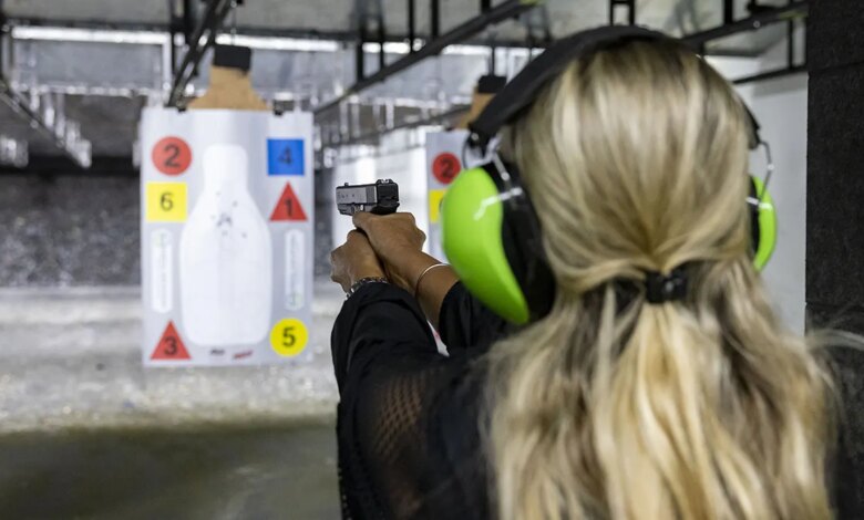 Participant using a handgun at a shooting range in Pompano Beach, Florida