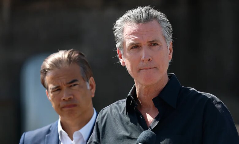 California Governor Gavin Newsom and Attorney General Rob Bonta standing at a news conference outdoors