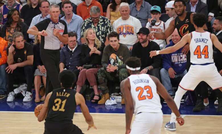 Actors Ben Stiller, Christine Taylor, Michael J. Fox, and Timothée Chalamet sit courtside at an NBA Eastern Conference Finals game.