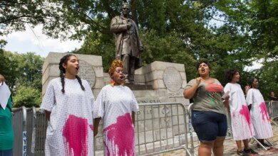 Darializa Auila-Chevalier and other protestors standing at rally in Manhattan