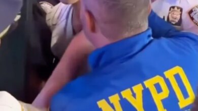An NYPD cop appeared to slam a Knicks fan's face into a pole during an arrest outside Madison Square Garden's Friday night victory celebration, shocking video shows.