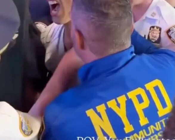 An NYPD cop appeared to slam a Knicks fan's face into a pole during an arrest outside Madison Square Garden's Friday night victory celebration, shocking video shows.