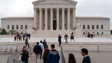 People walk outside the U.S. Supreme Court in Washington, D.C.