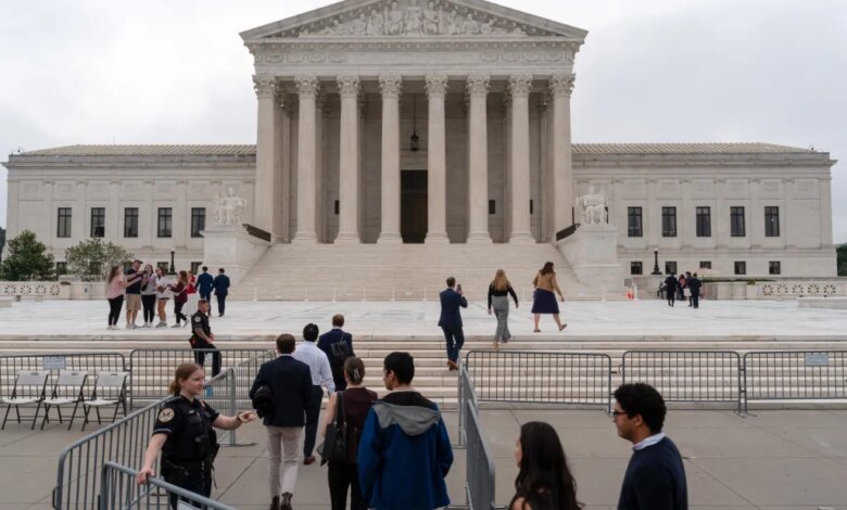 People walk outside the U.S. Supreme Court in Washington, D.C.