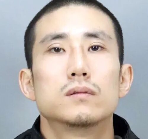 Mugshot of Myung Jin Kim, a California fugitive wanted in connection with two murders.