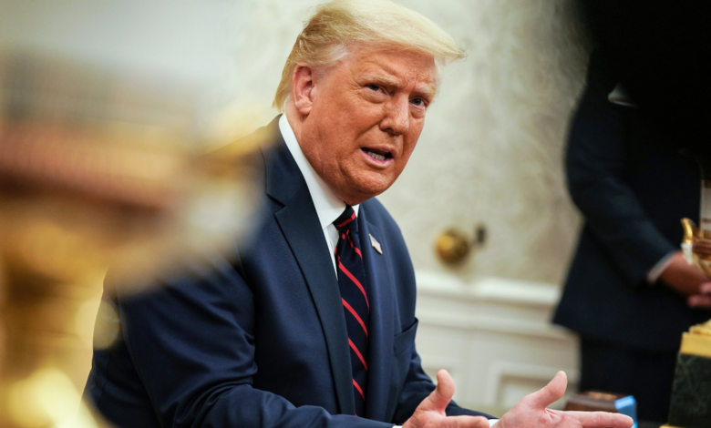 President Donald Trump talks to reporters during a meeting with Iraqi Prime Minister Mustafa Al-Kadhimi in the Oval Office at the White House.