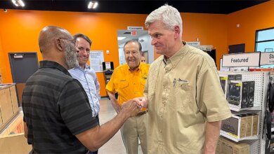 Sen. Bill Cassidy fist bumps a supporter at a gun retailer and firing range in Baton Rouge