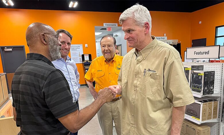 Sen. Bill Cassidy fist bumps a supporter at a gun retailer and firing range in Baton Rouge