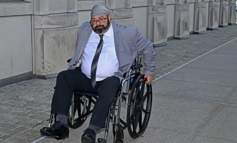 John Merrone in a wheelchair outside Brooklyn Federal Court.