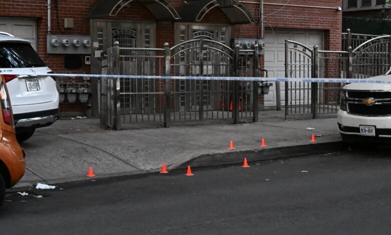 Crime scene tape and orange cones mark a residential area on Grand Avenue in the Bronx where a man was fatally shot.