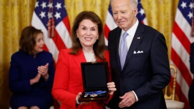 Bonnie Lautenberg, widow of former Sen. Frank Lautenberg, accepts the Medal of Freedom from President Joe Biden.