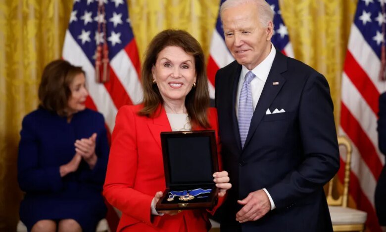 Bonnie Lautenberg, widow of former Sen. Frank Lautenberg, accepts the Medal of Freedom from President Joe Biden.