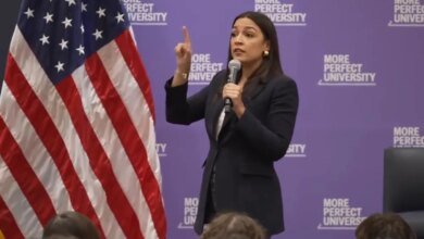 Alexandria Ocasio-Cortez speaking with students about relevant issues during a town hall.
