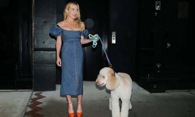 Tracy Anderson with her dog on a leash, attending Jennifer Fisher's Soho store opening party.