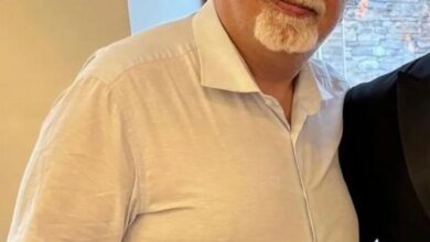 Kamran Hekmati, a man with a white goatee and glasses, in a white collared shirt.