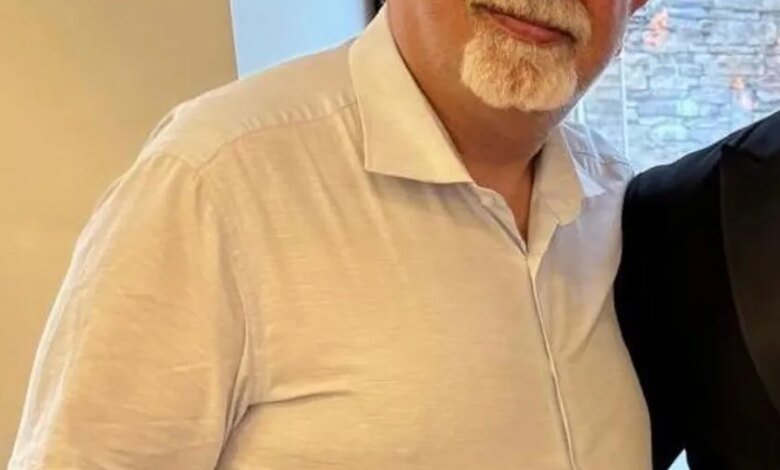 Kamran Hekmati, a man with a white goatee and glasses, in a white collared shirt.