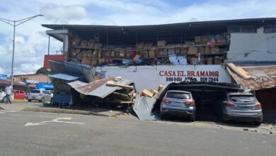 A damaged building with collapsed roofing and exposed storage shelves following an earthquake in Sona, Veraguas Province, Panama.