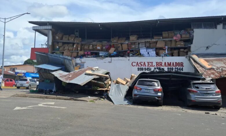 A damaged building with collapsed roofing and exposed storage shelves following an earthquake in Sona, Veraguas Province, Panama.