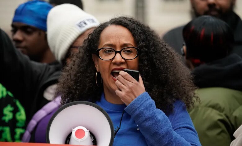 Chair and Executive Director of the NYC Commission on Racial Equity Linda Tigani speaks into a microphone during a rally in New York City.