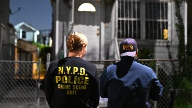 Members of the NYPD Crime Scene Unit investigate a fatal incident in South Jamaica.