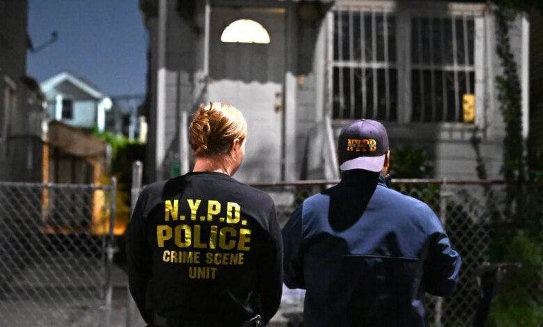 Members of the NYPD Crime Scene Unit investigate a fatal incident in South Jamaica.